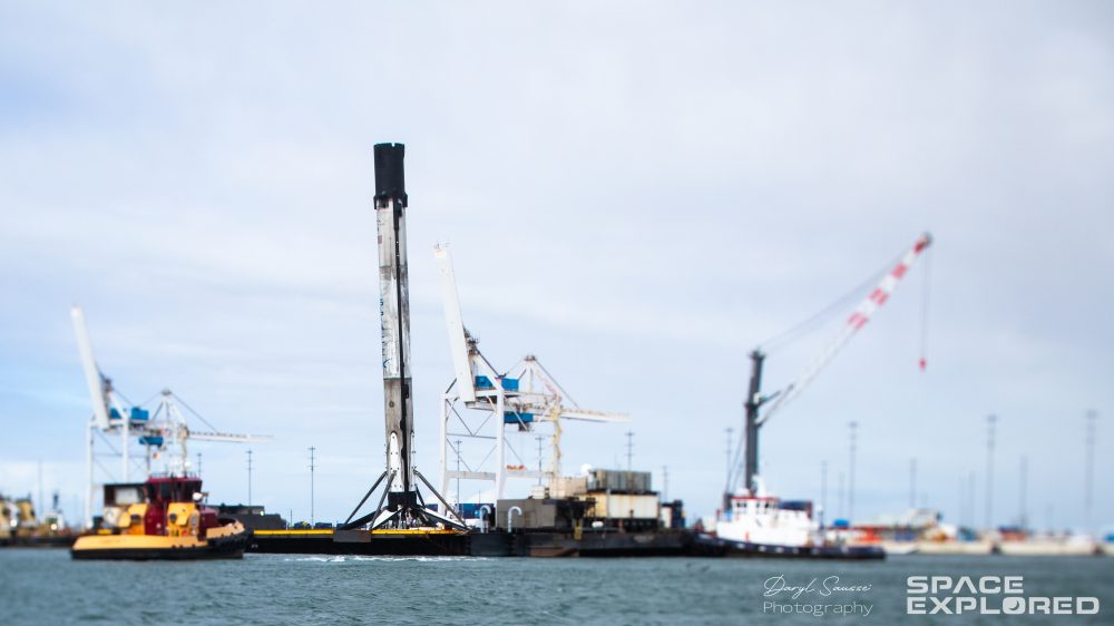 Falcon 9 booster from Crew-1 launch returns to port weathered and leaning