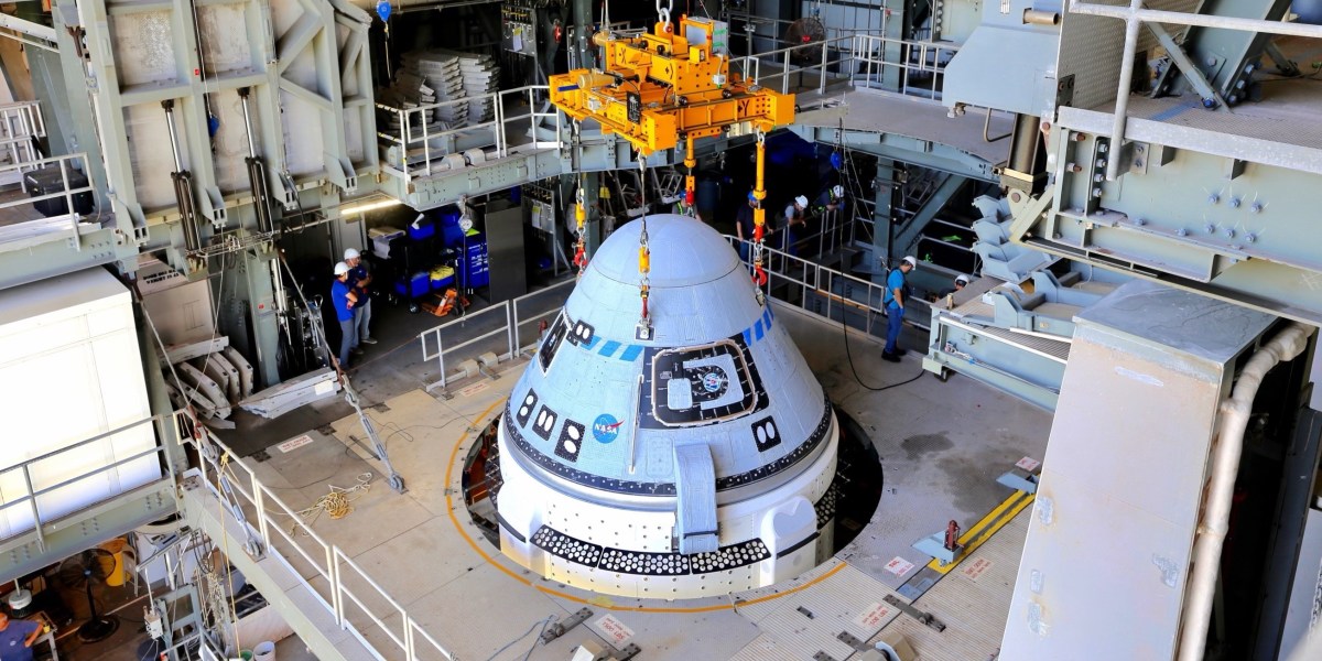 Starliner Capsule secured to Atlas Rocket