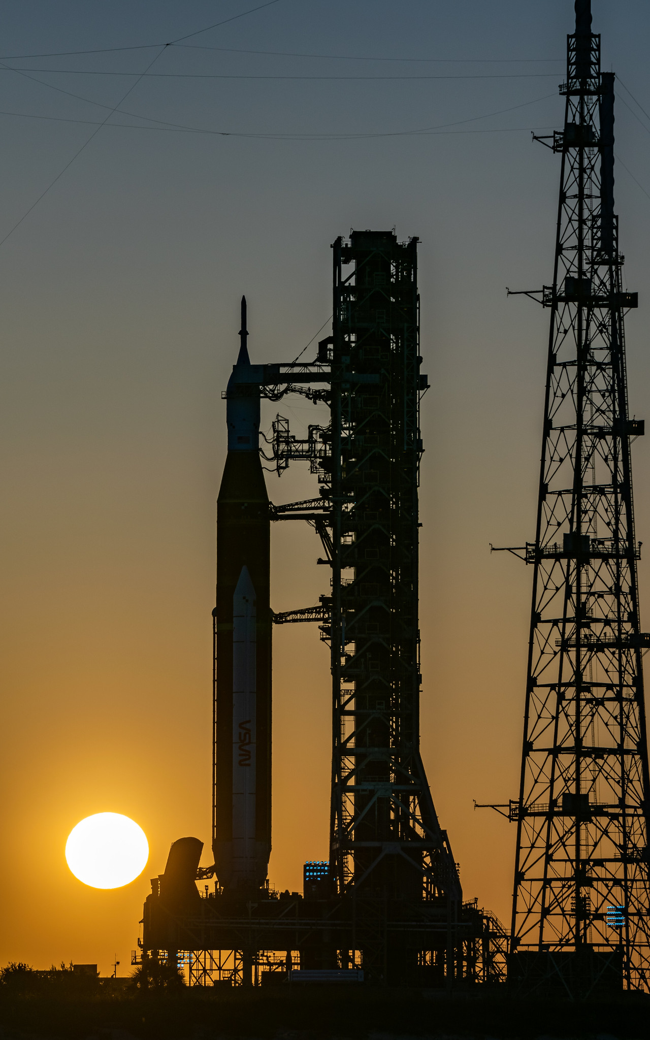The silhouette of SLS on LC-39B during sunset