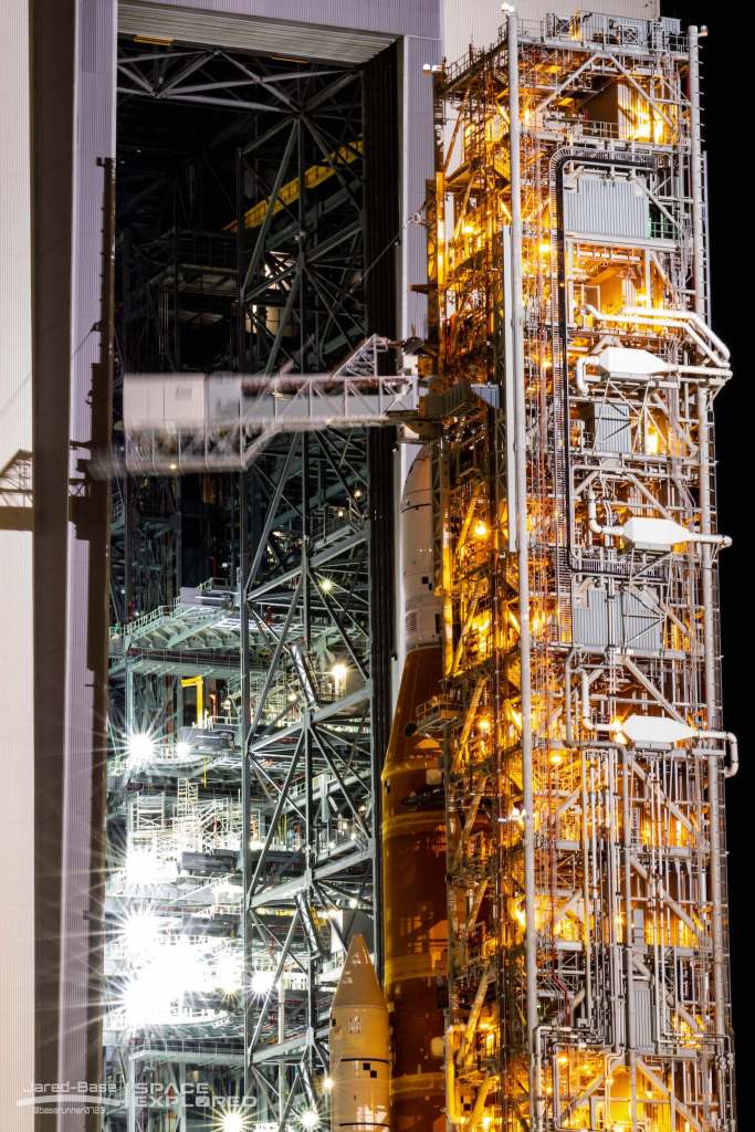 Crew access arm retracts from Orion outside the VAB.