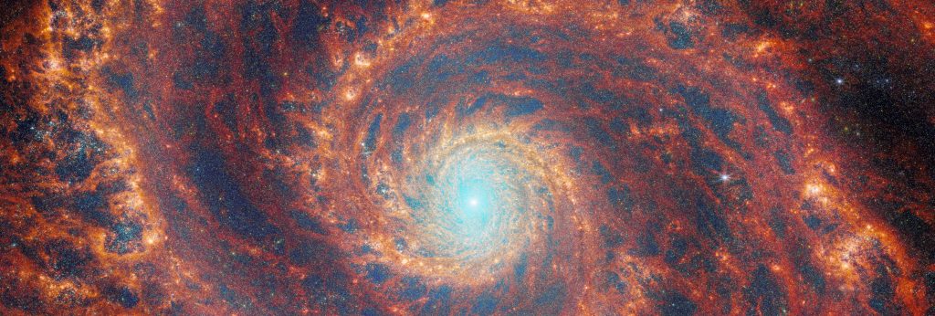 Composite image of galaxy M51 from both James Webb Space Telescope's Near-InfraRed Camera (NIRCam) and Mid-InfraRed Instrument (MIRI).
